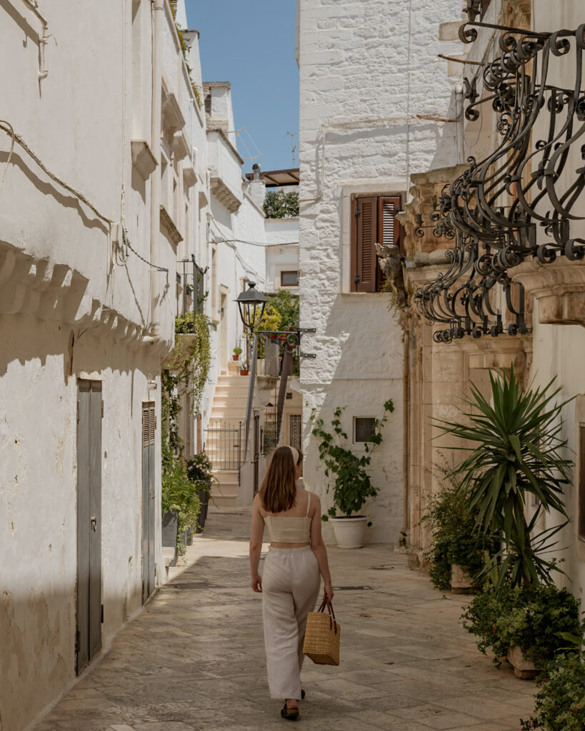 Puglia Itinerary: me walking through a whitewashed alley.